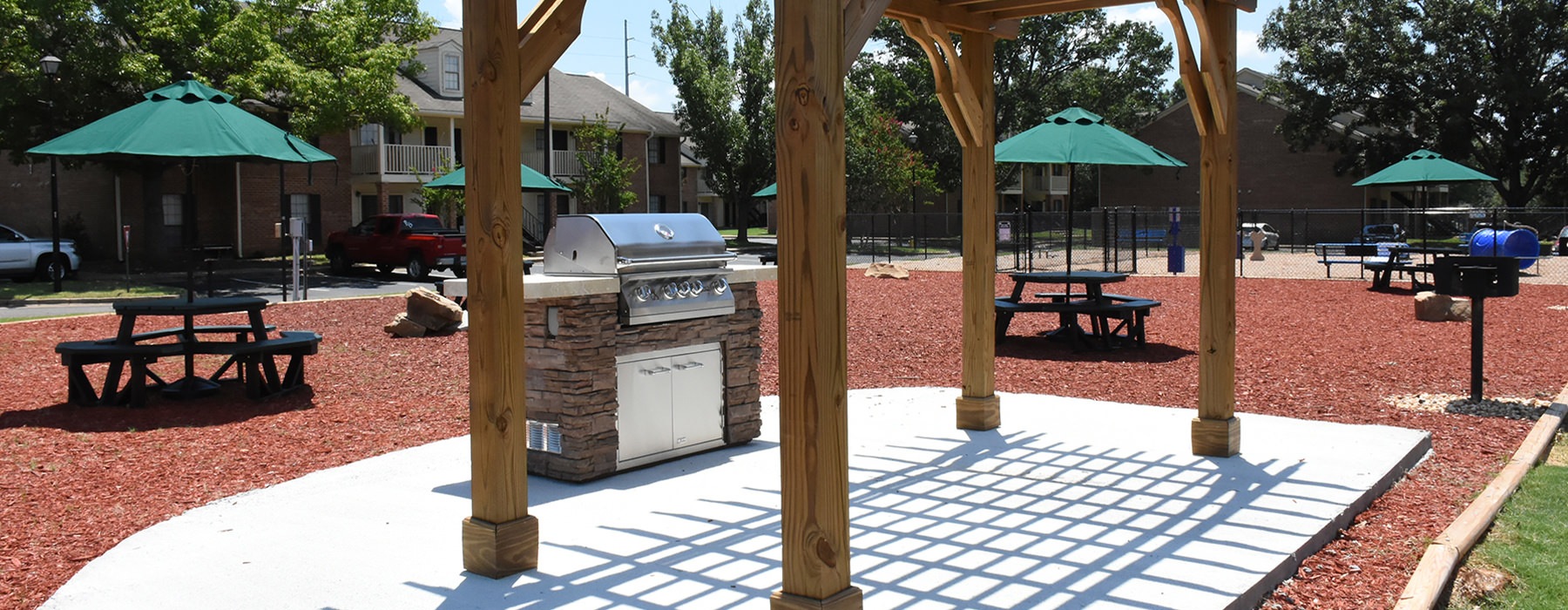 Grill station with picnic tables